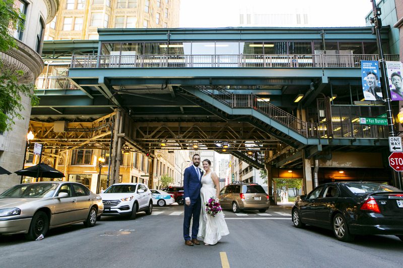 wedding photo outside of harold washington in chicago